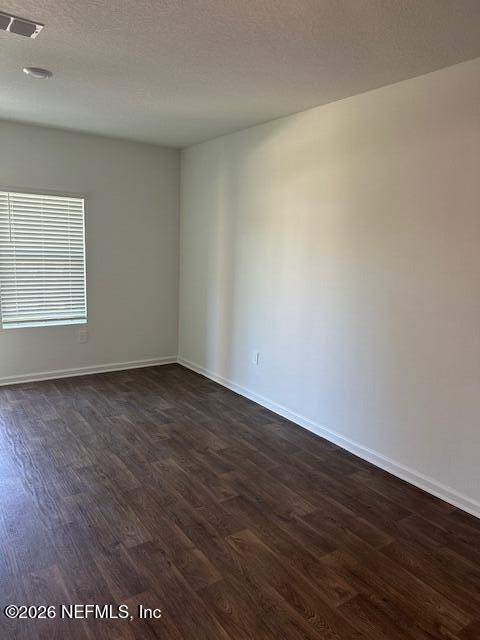 915 Rivertree Place Middleburg, FL 32068 - Photo 7 of 23 an empty room with wooden floor and windows