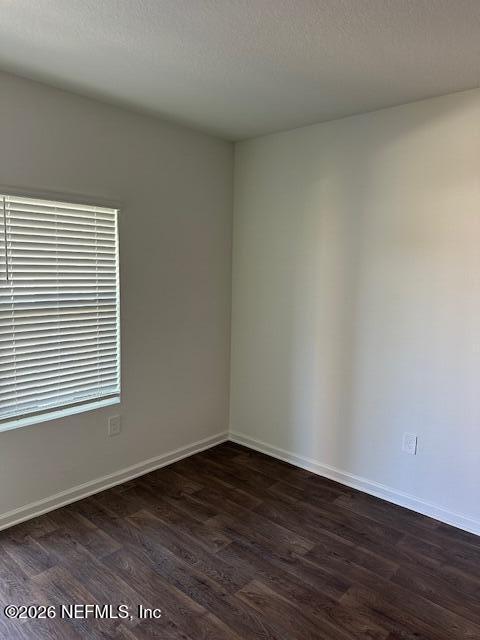 915 Rivertree Place Middleburg, FL 32068 - Photo 8 of 23 an empty room with wooden floor and a window