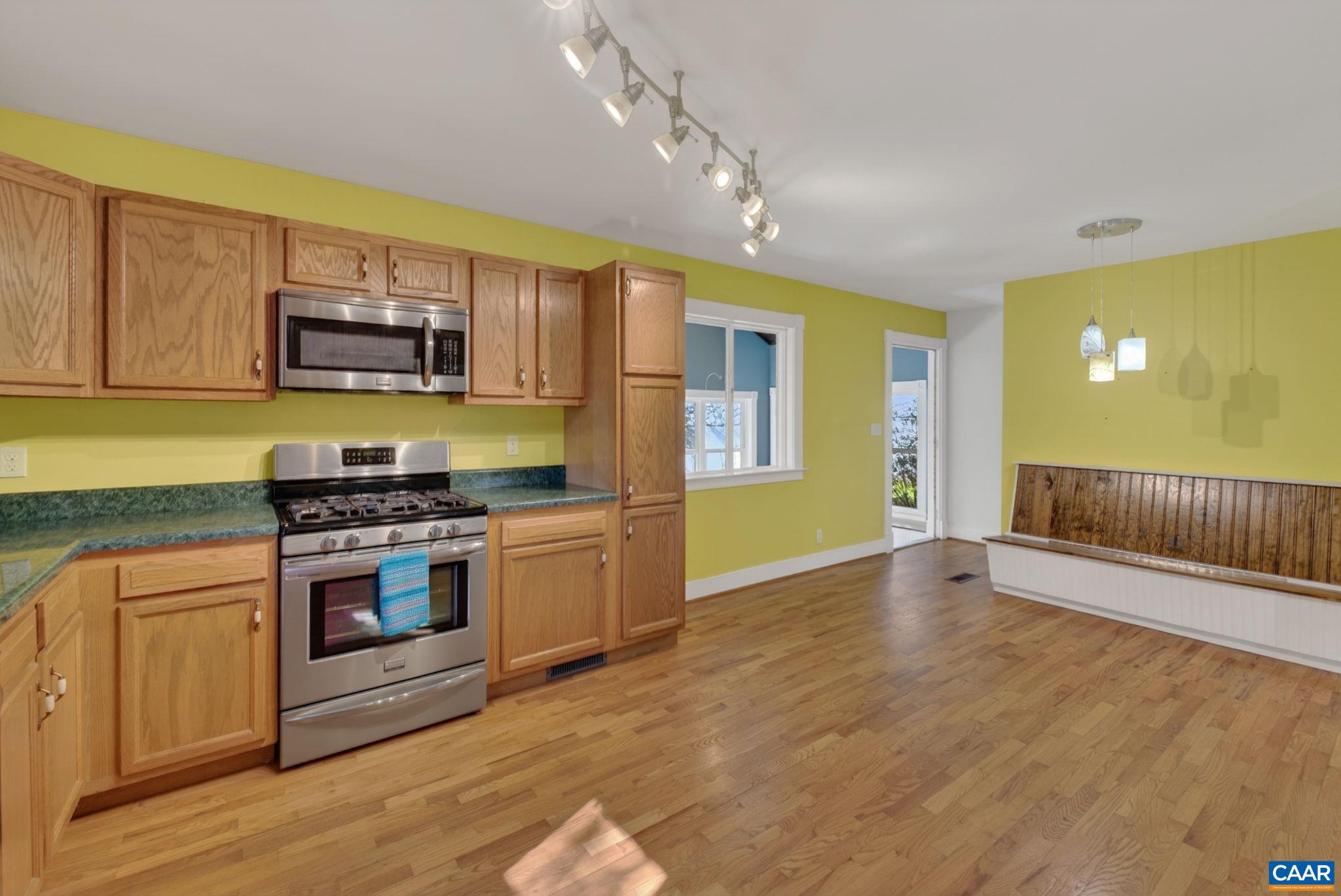 689 Mutton Hollow Road Stanardsville, VA 22973 - Photo 39 of 61 a kitchen with stainless steel appliances granite countertop a stove and a sink