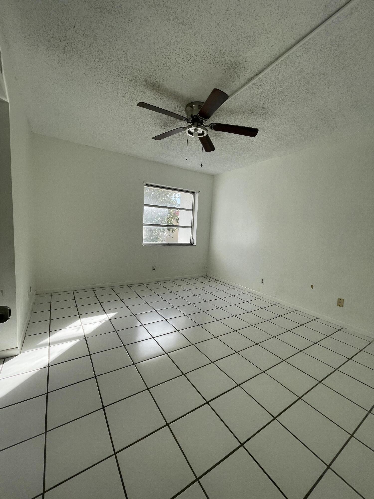 636 Northwest 13th Street, Unit 380 Boca Raton, FL 33486 - Photo 5 of 14 a view of a room and window