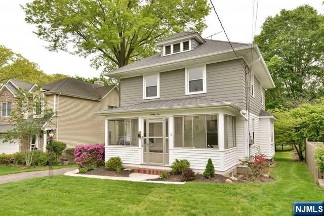 71 Everett Street Closter, NJ 07624 - Photo 2 of 12 a front view of a house with a yard