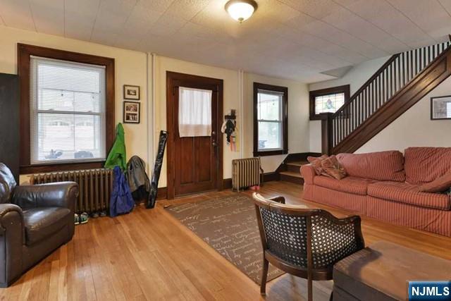 71 Everett Street Closter, NJ 07624 - Photo 4 of 12 a living room with furniture a couch and large window