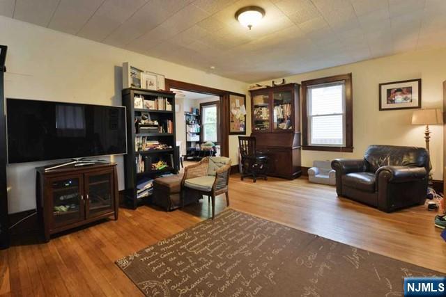 71 Everett Street Closter, NJ 07624 - Photo 5 of 12 a living room with furniture and a flat screen tv
