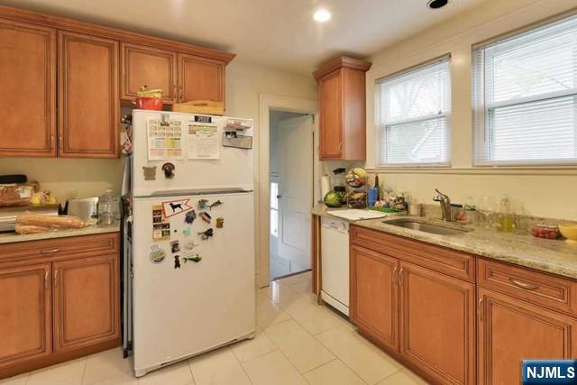 71 Everett Street Closter, NJ 07624 - Photo 6 of 12 a kitchen with stainless steel appliances granite countertop a refrigerator sink and cabinets