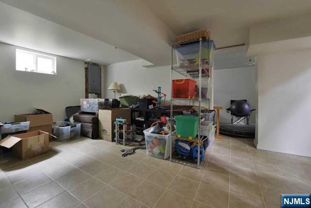 71 Everett Street Closter, NJ 07624 - Photo 9 of 12 a children room with furniture and a fan
