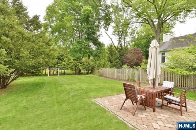 71 Everett Street Closter, NJ 07624 - Photo 10 of 12 a view of a chairs and table in backyard