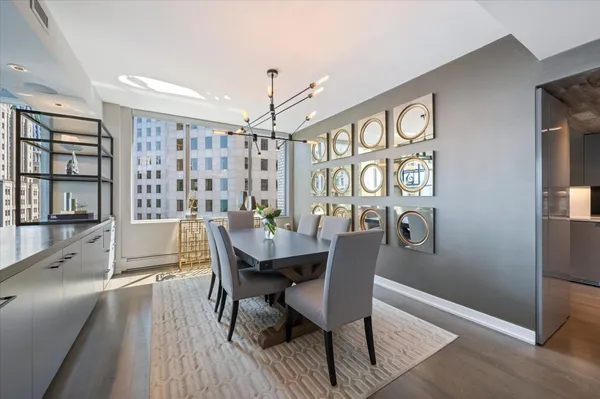 a view of a dining room with furniture window and wooden floor