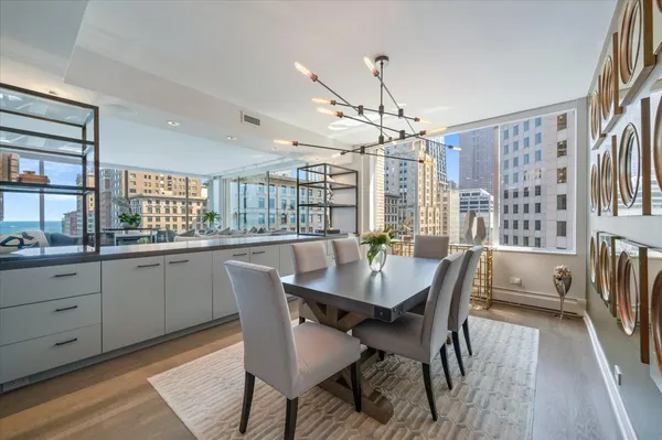 a kitchen with stainless steel appliances a stove refrigerator and cabinets