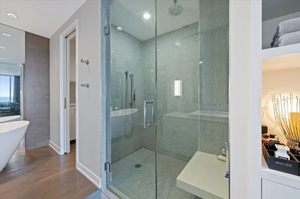 a bathroom with a shower and a sink