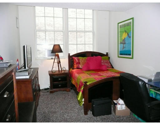 200 Market Street, Unit 3305 Lowell, MA 01852 - Photo 3 of 7 a bedroom with a bed and a window