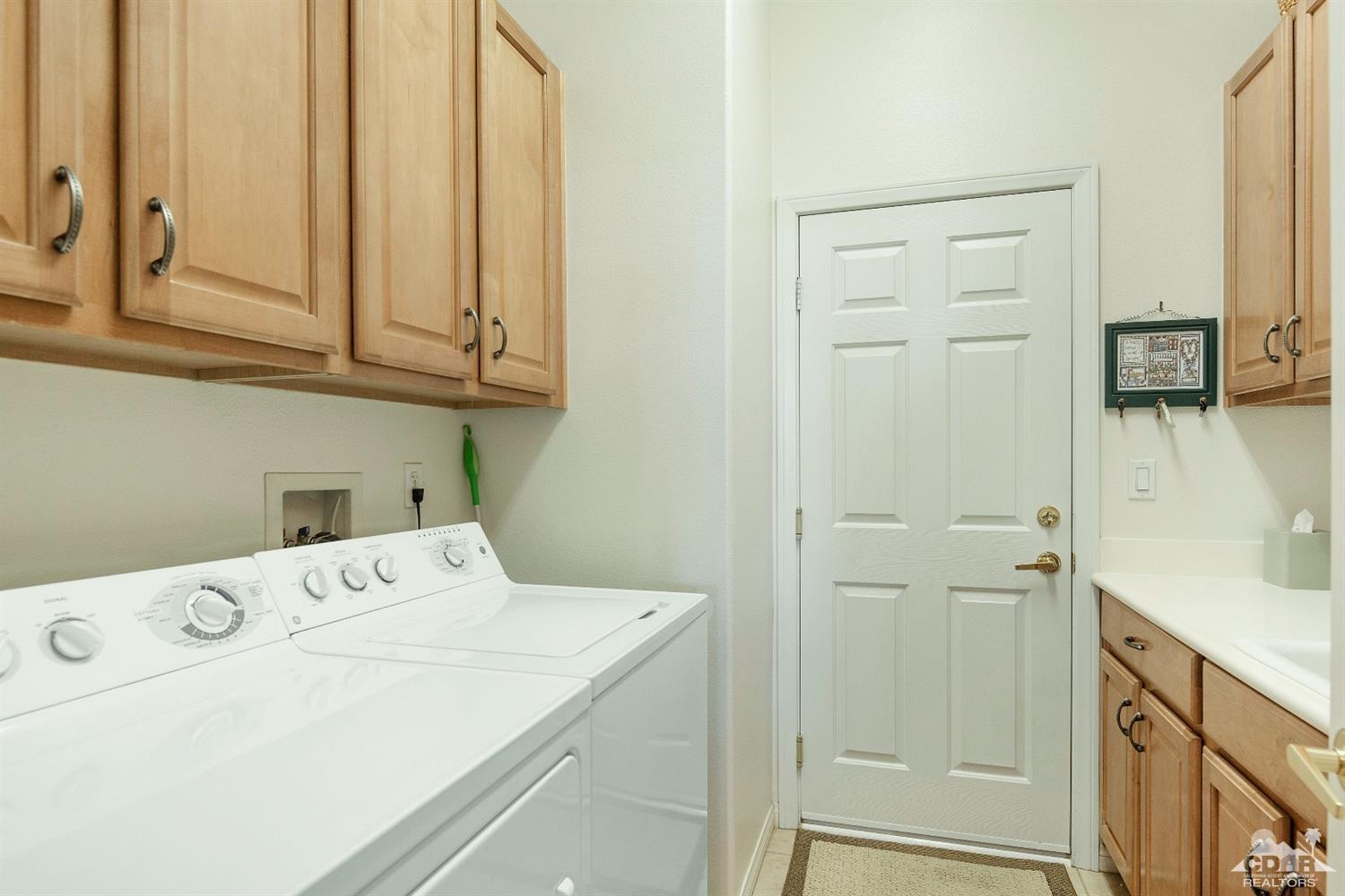 80561 Knightswood Road Indio, CA 92201 - Photo 15 of 25 a utility room with dryer and washer