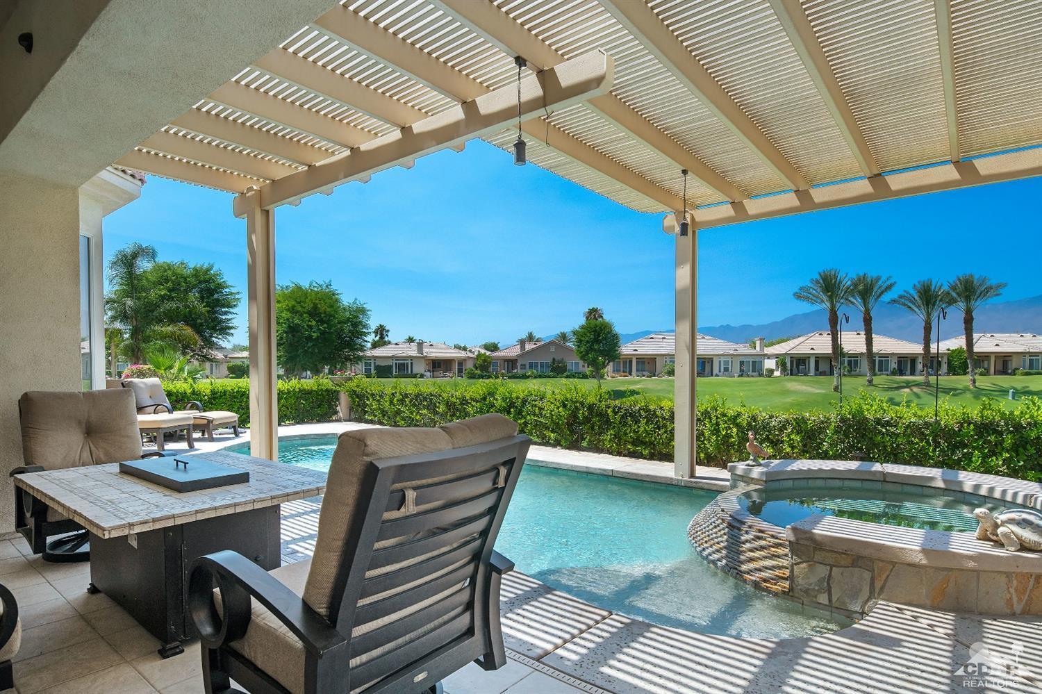 80561 Knightswood Road Indio, CA 92201 - Photo 16 of 25 a view of a patio with couches table and chairs