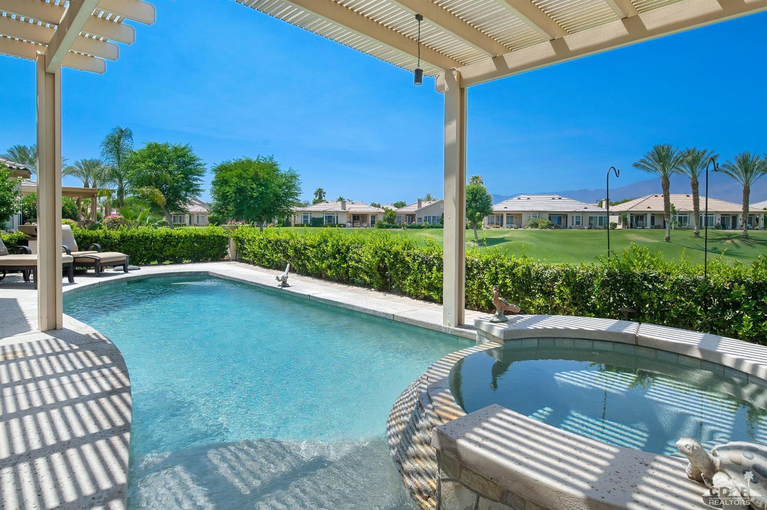 80561 Knightswood Road Indio, CA 92201 - Photo 17 of 25 a view of a swimming pool with a patio