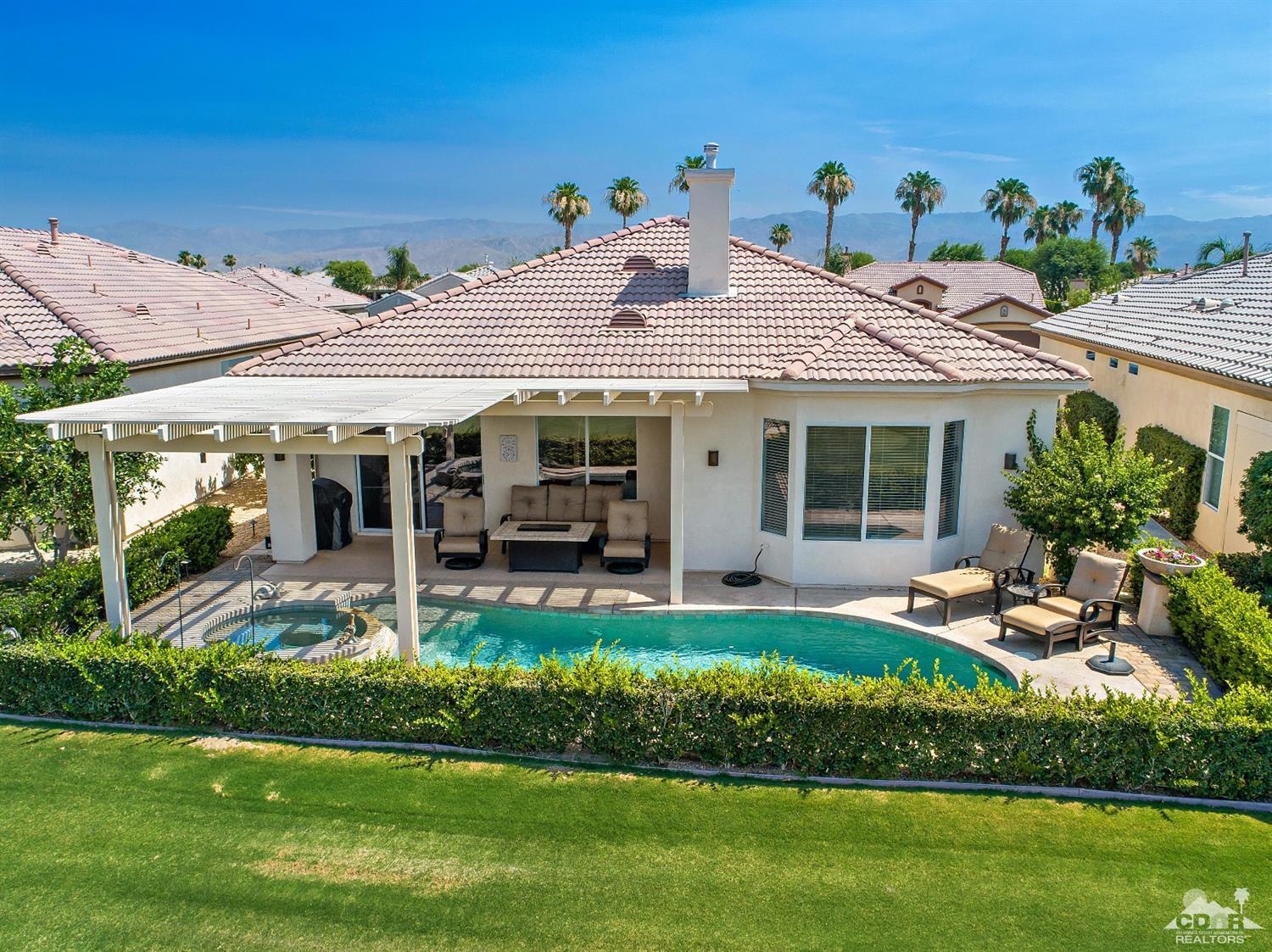 80561 Knightswood Road Indio, CA 92201 - Photo 24 of 25 a front view of house with a garden and patio