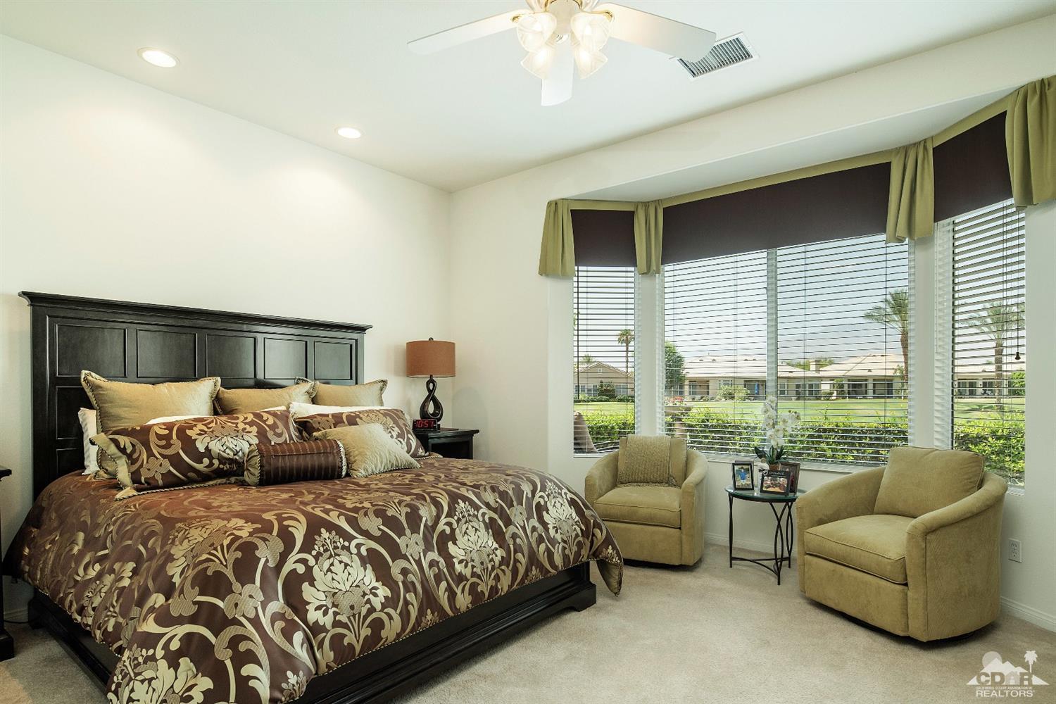 80561 Knightswood Road Indio, CA 92201 - Photo 9 of 25 a bedroom with a bed and a couch