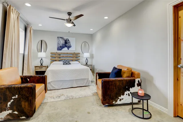 a bedroom with furniture and a window