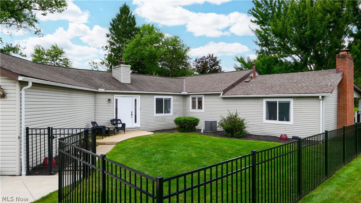 11247 Prospect Road Strongsville, OH 44149 - Photo 10 of 49 Rear view of property featuring a yard, a patio, and central air condition unit