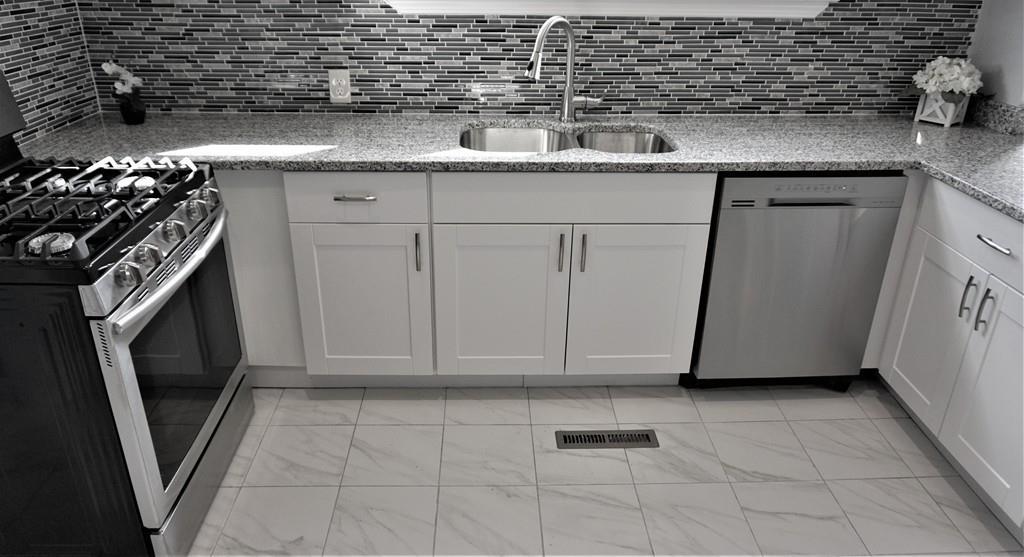 49 Ranney Street Springfield, MA 01108 - Photo 14 of 29 a kitchen with a sink and cabinets