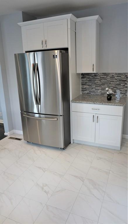49 Ranney Street Springfield, MA 01108 - Photo 17 of 29 a kitchen with cabinets and stainless steel appliances