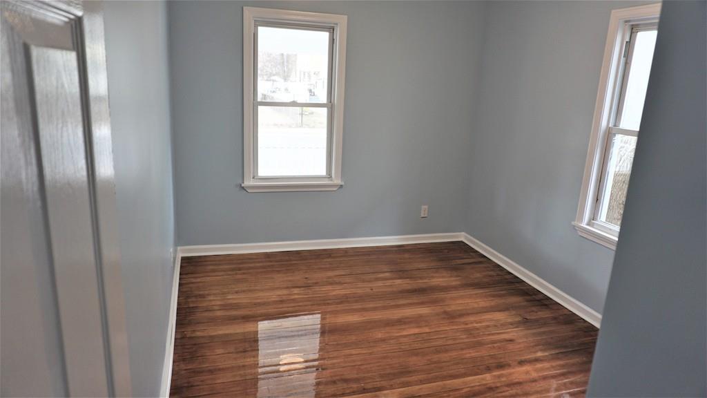 49 Ranney Street Springfield, MA 01108 - Photo 24 of 29 a view of empty room with wooden floor