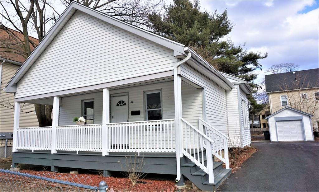 49 Ranney Street Springfield, MA 01108 - Photo 27 of 29 a small white building with a large window and wooden fence
