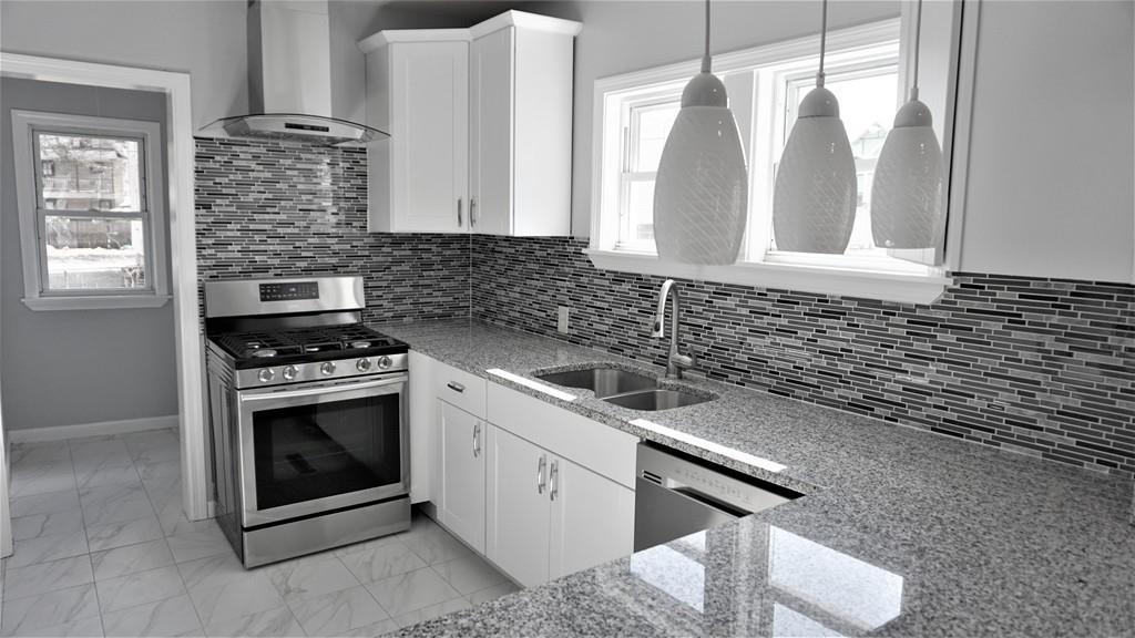 49 Ranney Street Springfield, MA 01108 - Photo 5 of 29 a kitchen with cabinets and appliances