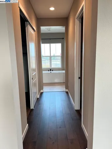 a living room with a flat screen tv furniture and a window