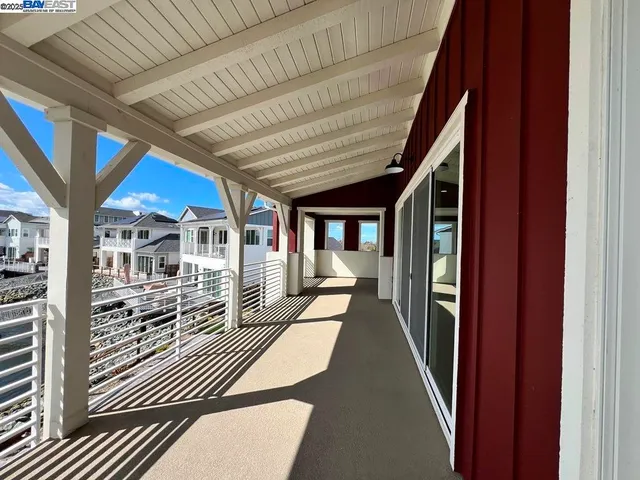 a view of a porch with a wooden fence