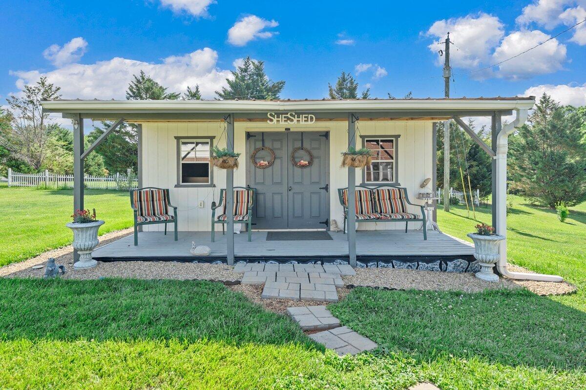 3226 Rakes Road Rocky Mount, VA 24151 - Photo 57 of 74 a front view of house with a garden and patio
