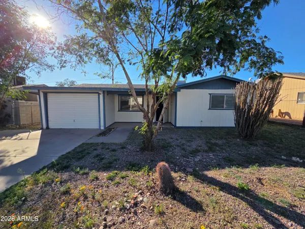 a view of a house with a yard