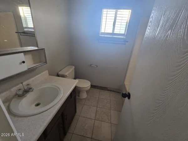 a bathroom with a sink and toilet