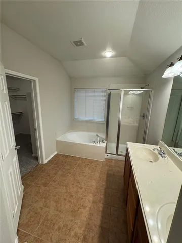 a bedroom with a bed and a sink
