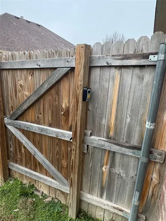 a view of balcony with wooden floor and fence