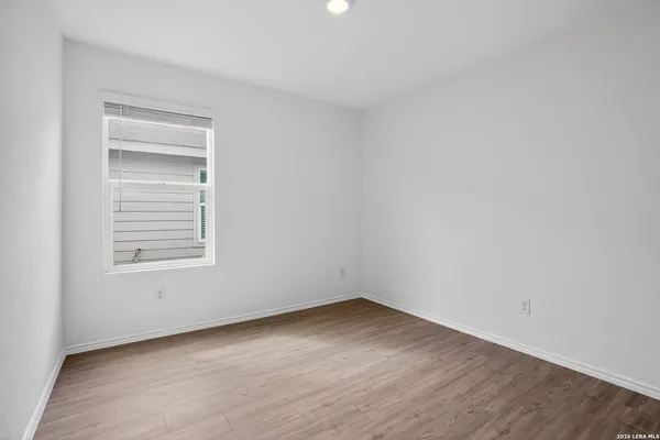 a view of a room that has wooden floor in it