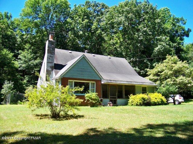 362 Camelback Road Tannersville, PA 18372 - Photo 1 of 13 a front view of a house with a yard