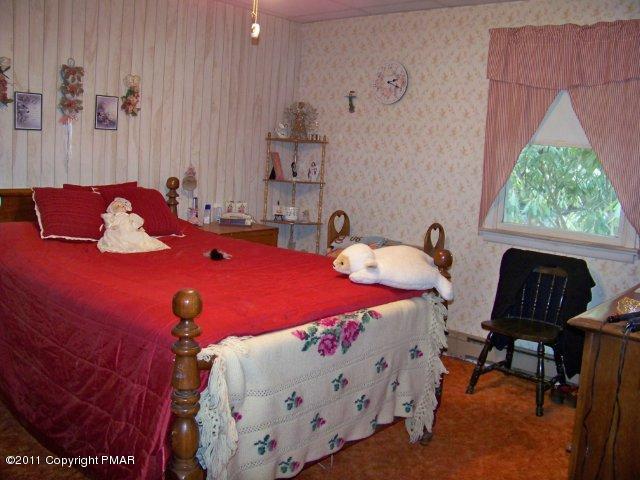 362 Camelback Road Tannersville, PA 18372 - Photo 5 of 13 a bedroom with a bed and a window