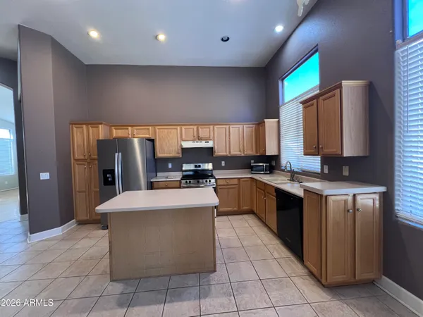 a large kitchen with a large counter top