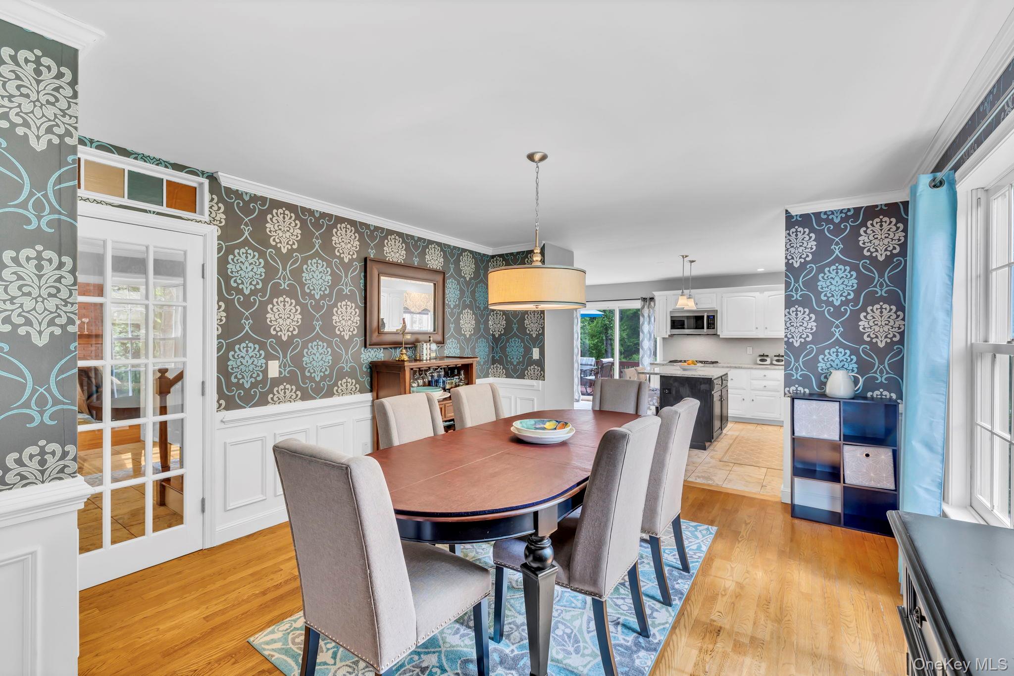 74 Vincent Lane Stone Ridge, NY 12484 - Photo 13 of 49 a dining room with furniture a rug and wooden floor