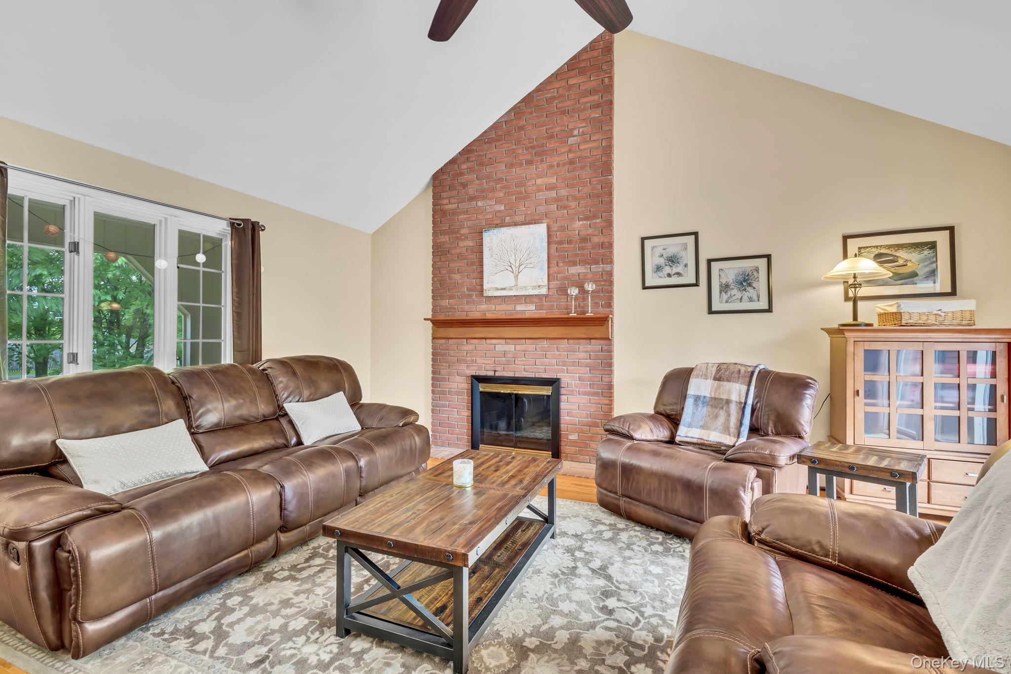 74 Vincent Lane Stone Ridge, NY 12484 - Photo 20 of 49 a living room with furniture fireplace and a large window