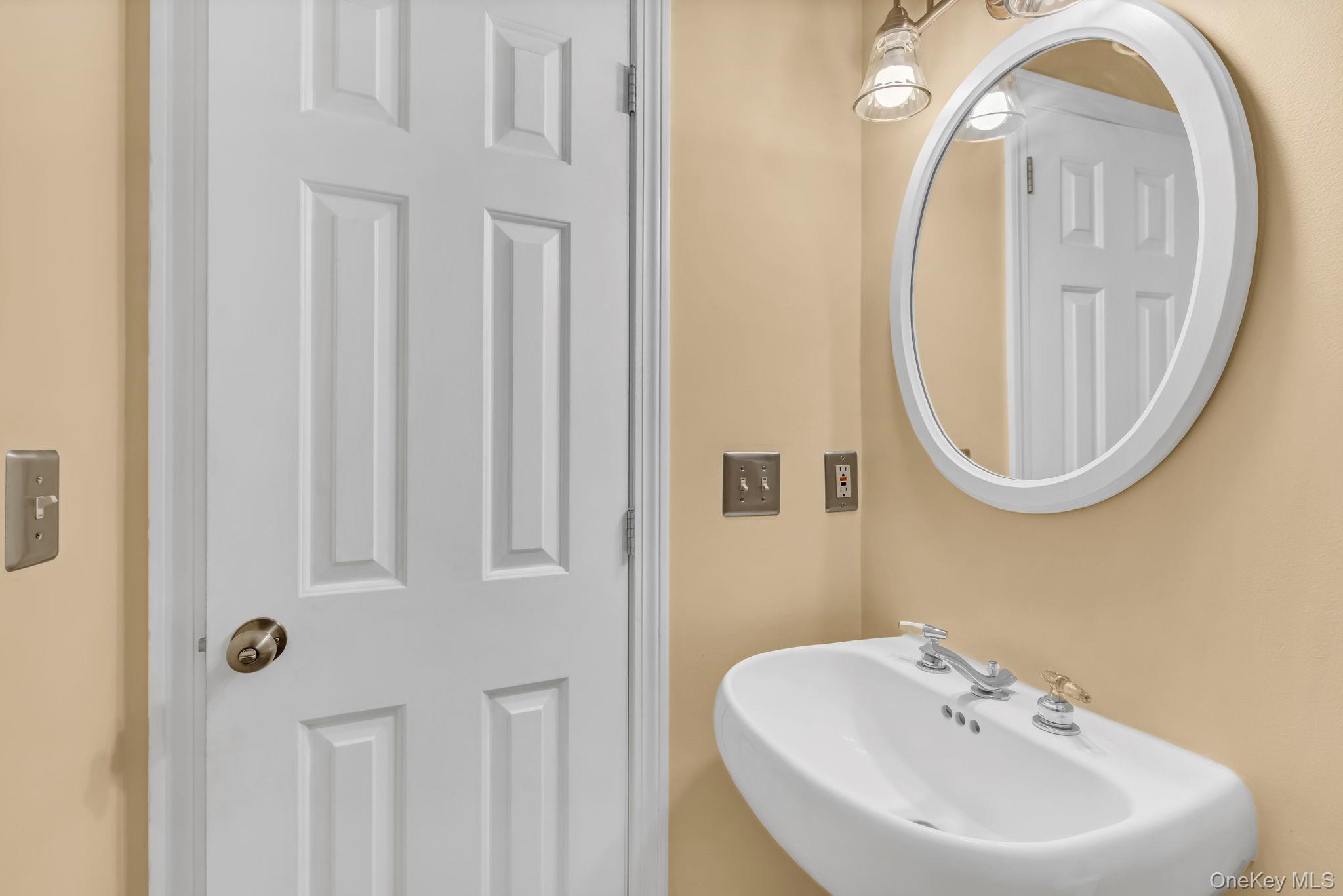 74 Vincent Lane Stone Ridge, NY 12484 - Photo 23 of 49 a bathroom with a sink and a mirror