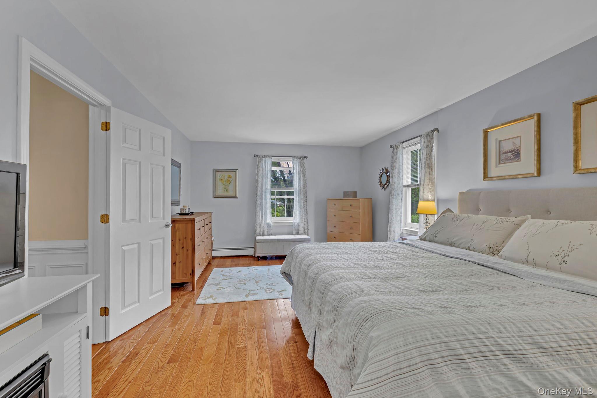 74 Vincent Lane Stone Ridge, NY 12484 - Photo 25 of 49 a bedroom with a bed and a flat screen tv