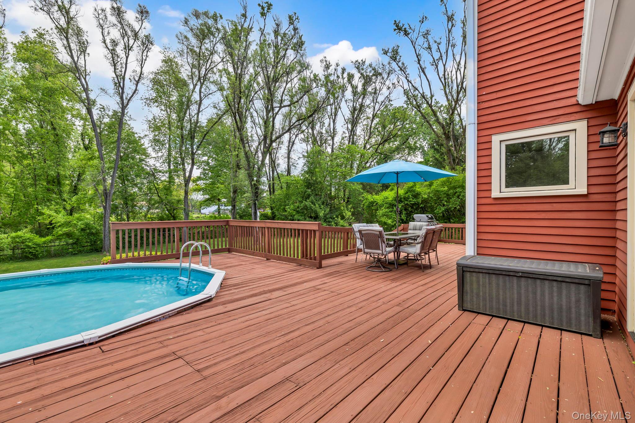 74 Vincent Lane Stone Ridge, NY 12484 - Photo 37 of 49 a view of a chairs setting on the wooden deck