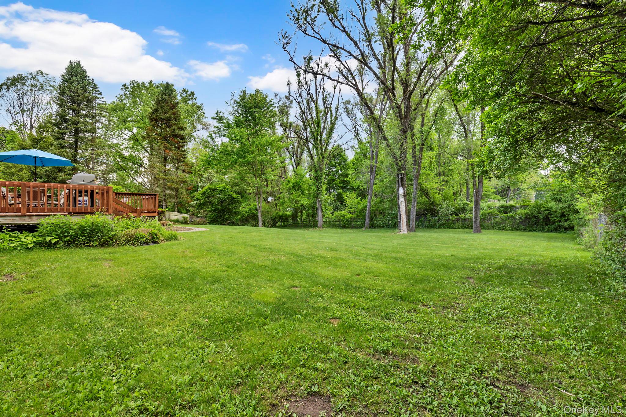 74 Vincent Lane Stone Ridge, NY 12484 - Photo 44 of 49 a view of a garden with a building in the background