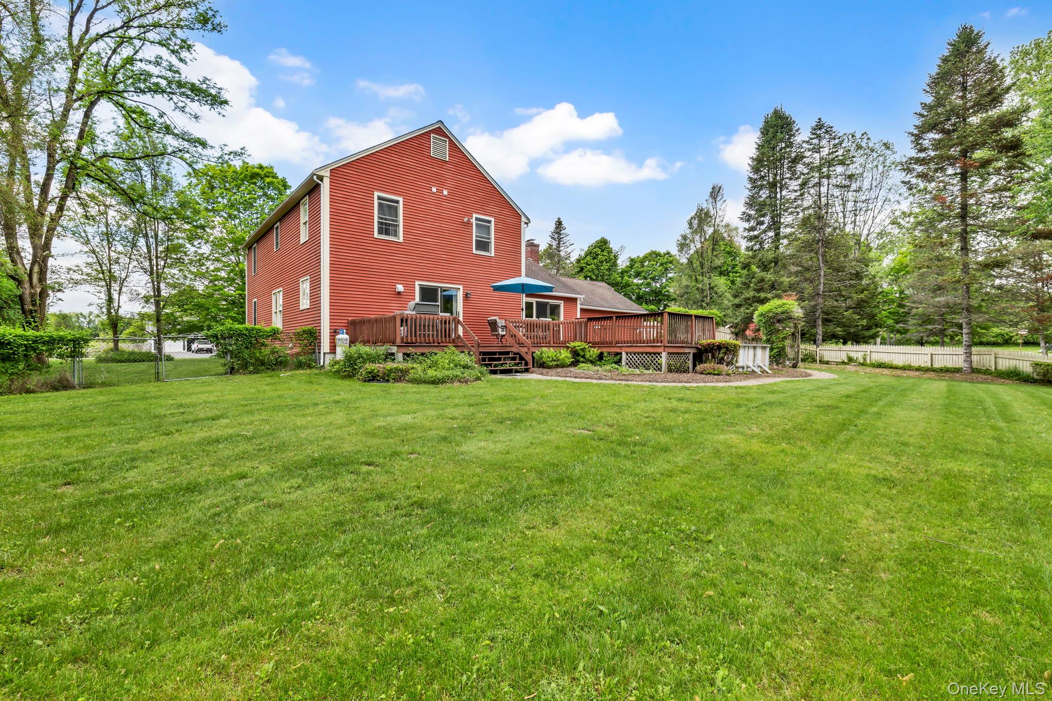 74 Vincent Lane Stone Ridge, NY 12484 - Photo 45 of 49 a front view of a house with garden and trees