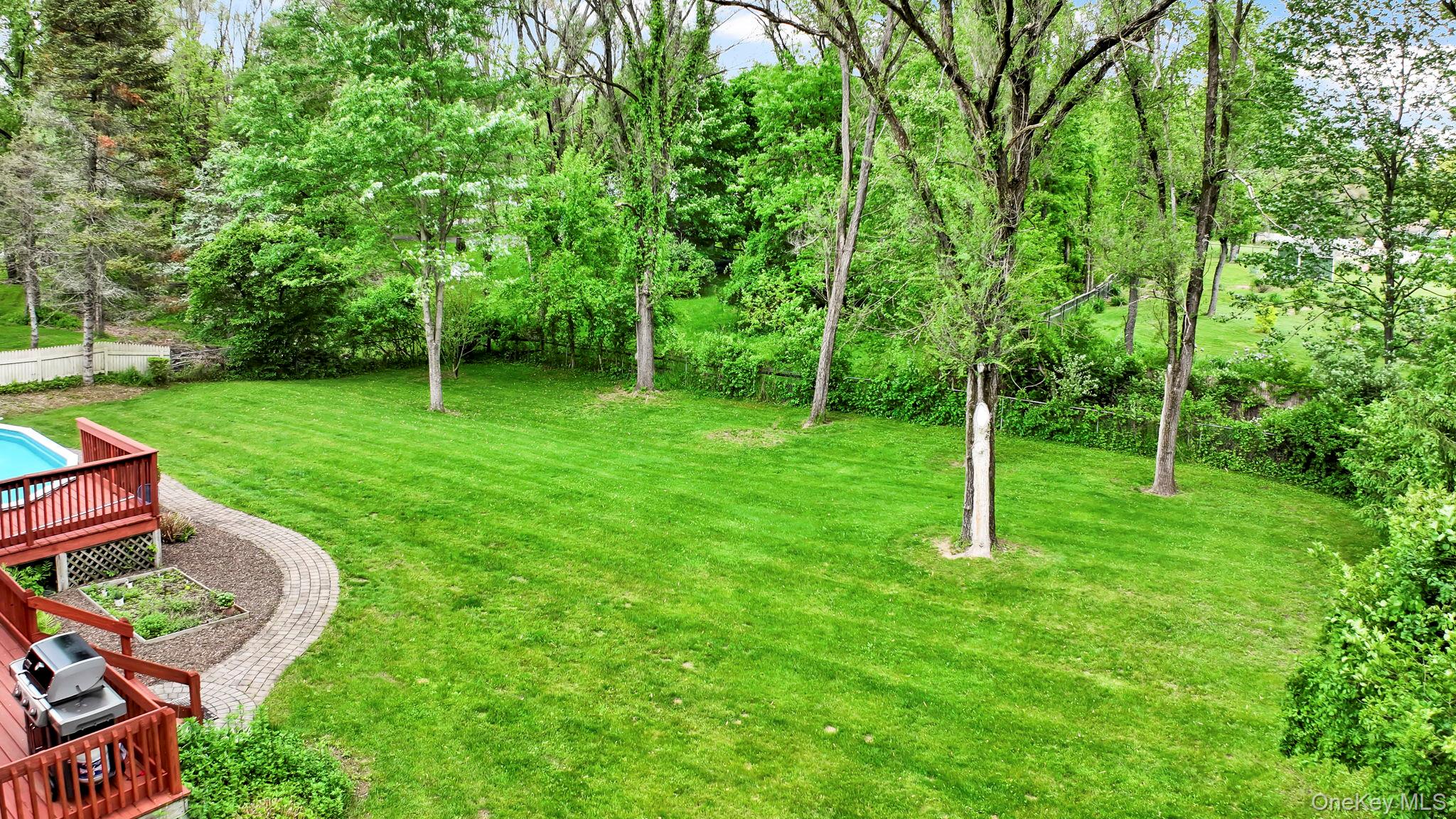 74 Vincent Lane Stone Ridge, NY 12484 - Photo 46 of 49 a backyard of a house with table and chairs