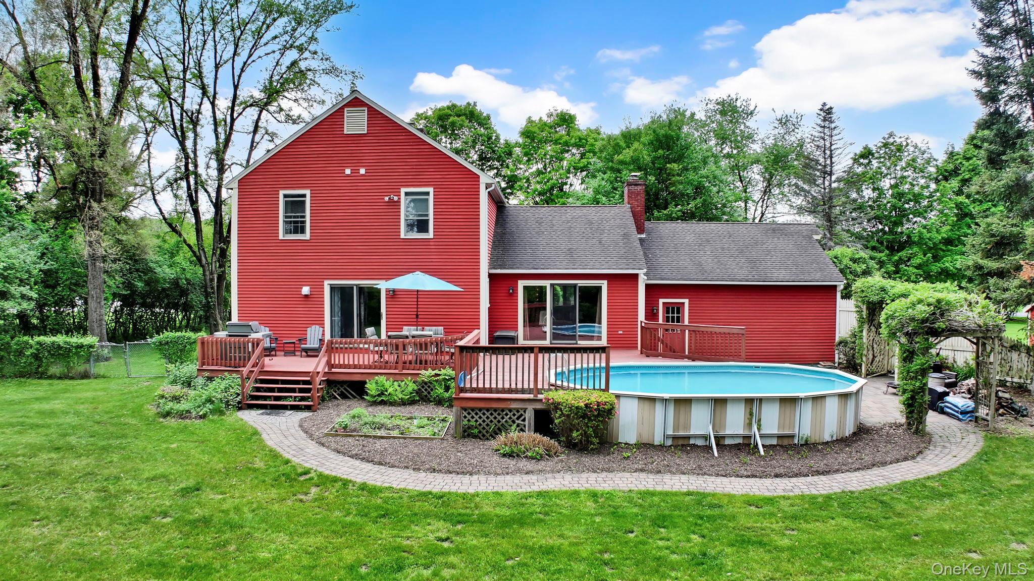 74 Vincent Lane Stone Ridge, NY 12484 - Photo 5 of 49 a front view of a house with a yard table and chairs