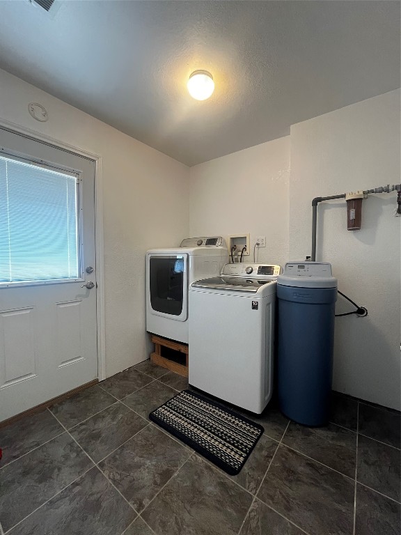1100 Swiss Alp Hills Loop Schulenburg, TX 78956 - Photo 26 of 40 a utility room with dryer and washer