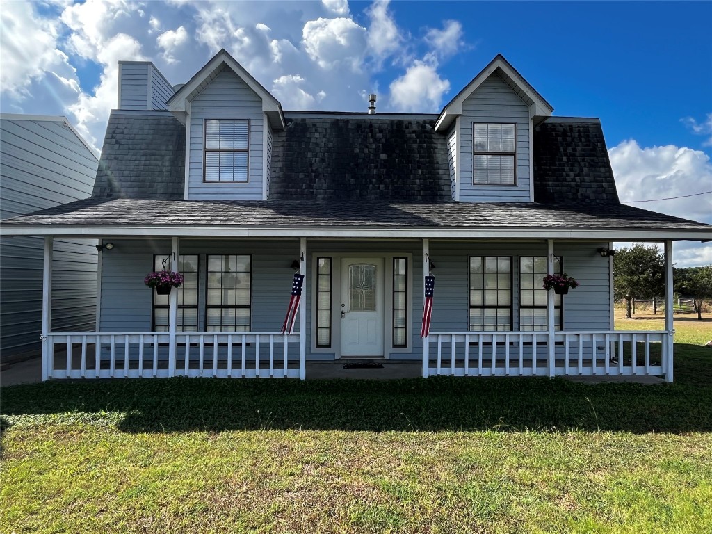 1100 Swiss Alp Hills Loop Schulenburg, TX 78956 - Photo 5 of 40 a front view of a house with garden