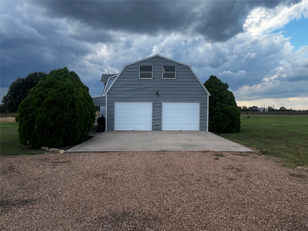 1100 Swiss Alp Hills Loop Schulenburg, TX 78956 - Photo 8 of 40 a front view of a house with a yard