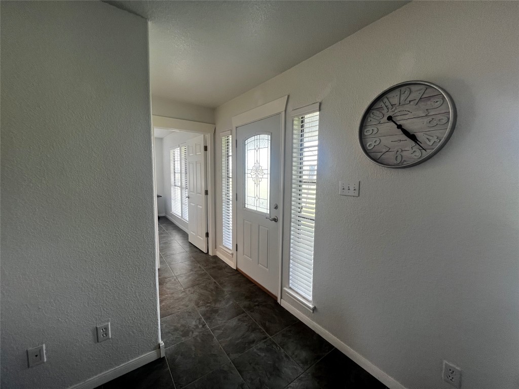 1100 Swiss Alp Hills Loop Schulenburg, TX 78956 - Photo 10 of 40 a view of a hallway with wooden door